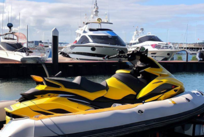 Jet Ski Pontoon Boat at harbour